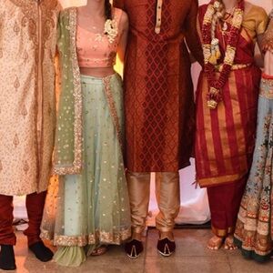 Embroidered green lehenga and dupatta with pink blouse